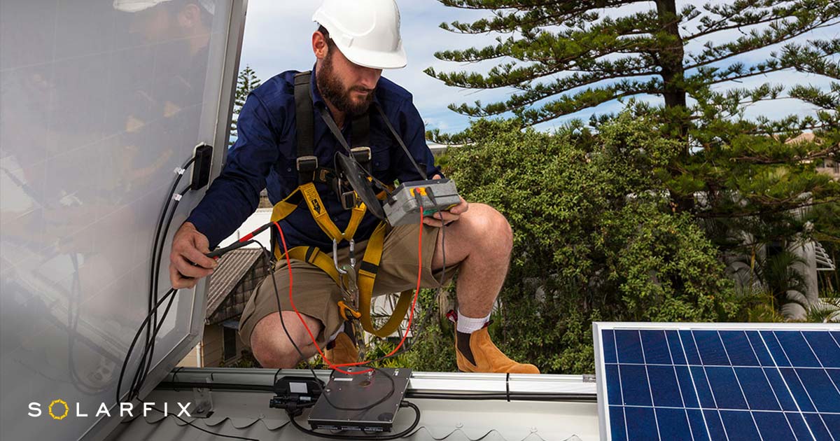 Solarfix solar repair technician on Brisbane roof inspecting solar system